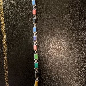 Silver bracelet with multiple colored stones